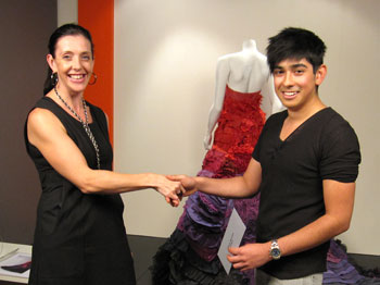 Carlos Bouman receives the People's Choice Award  from Dyson's Erica Galea